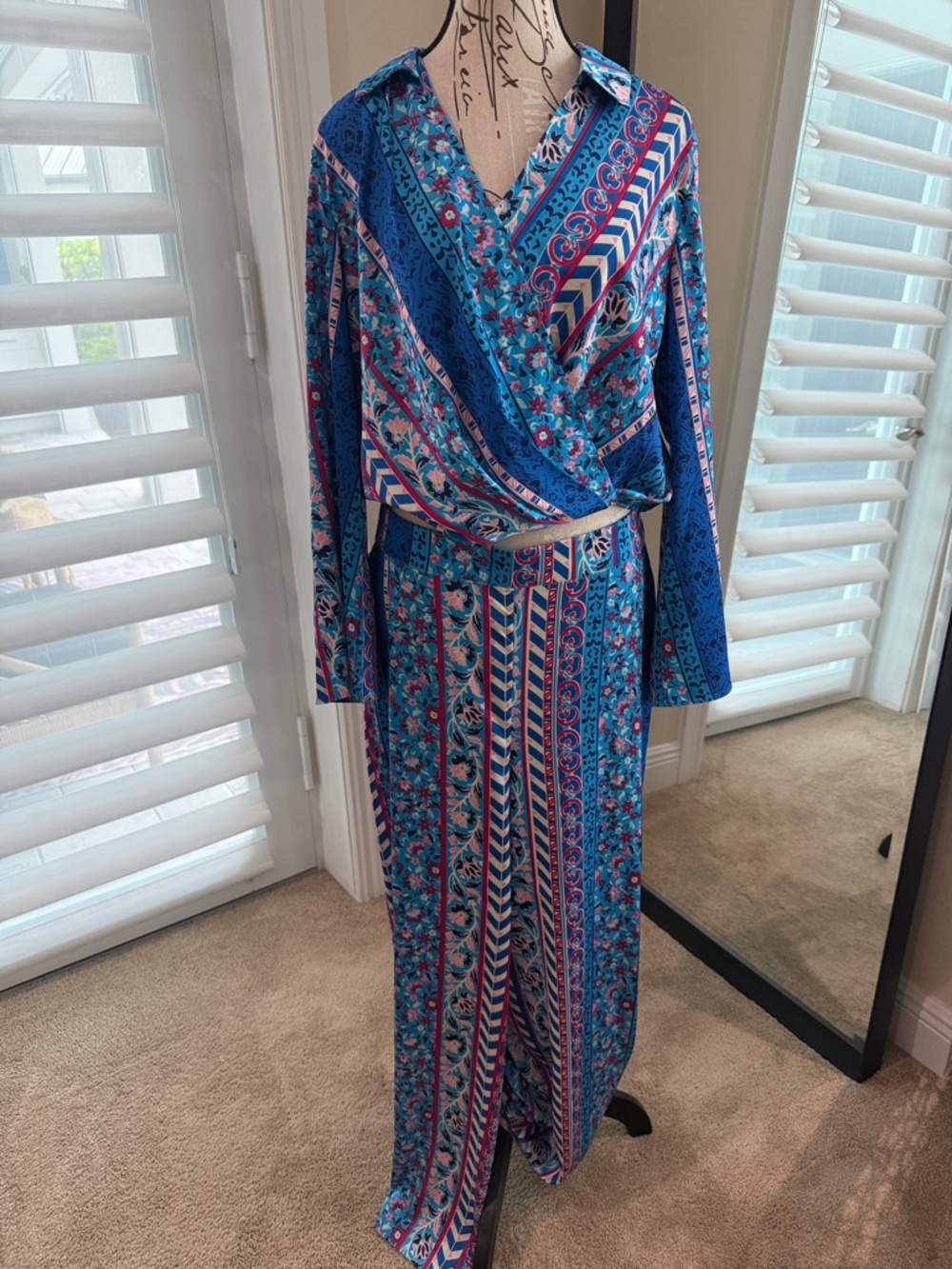 Get vacation ready! Blue Floral & Stripe Wrap top and pant set from Belks!